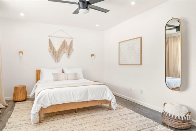 bedroom featuring recessed lighting, baseboards, wood finished floors, and ceiling fan