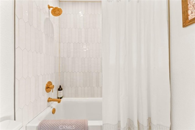 bathroom with shower / bath combination with curtain