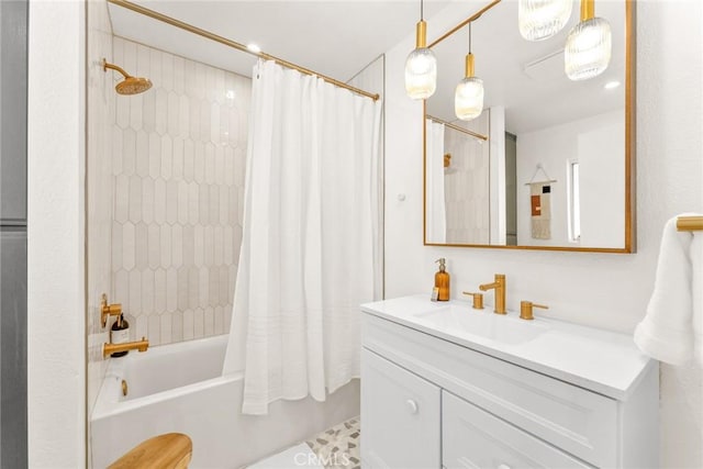 bathroom with shower / bath combo with shower curtain and vanity