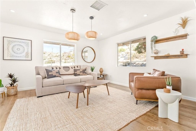 living room featuring wood finished floors and baseboards