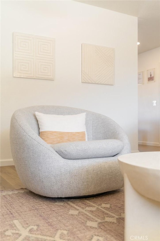 sitting room with recessed lighting, baseboards, and wood finished floors