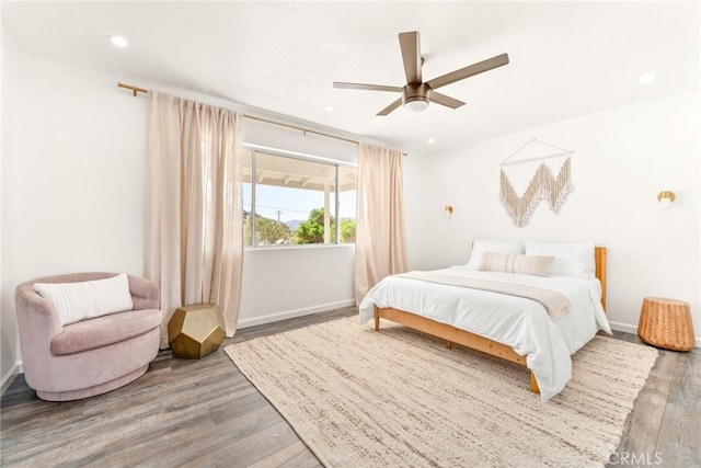 bedroom featuring recessed lighting, a ceiling fan, baseboards, and wood finished floors