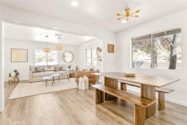 dining room with recessed lighting, baseboards, light wood-type flooring, and breakfast area