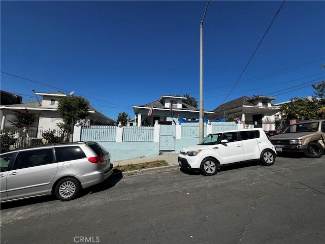 view of front of property with a gate and fence