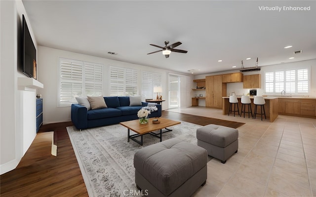 living area with recessed lighting, visible vents, ceiling fan, and light tile patterned floors