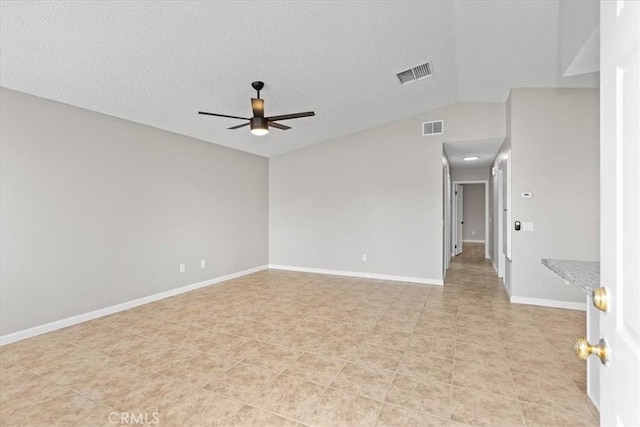 unfurnished room featuring visible vents, baseboards, lofted ceiling, and a ceiling fan