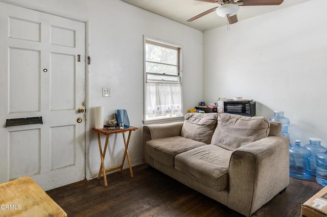 living room with a toaster, wood finished floors, and a ceiling fan