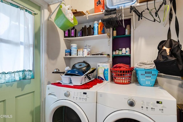 laundry area featuring washing machine and clothes dryer and laundry area