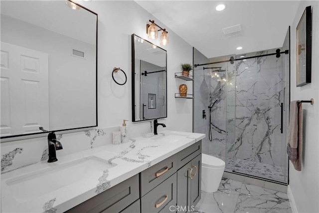 bathroom with visible vents, a marble finish shower, a sink, toilet, and marble finish floor