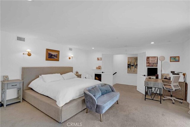 bedroom with recessed lighting, visible vents, and carpet floors