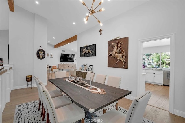 dining space featuring recessed lighting, baseboards, light wood-type flooring, and an inviting chandelier