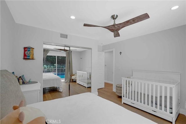 bedroom with recessed lighting, wood finished floors, and ceiling fan