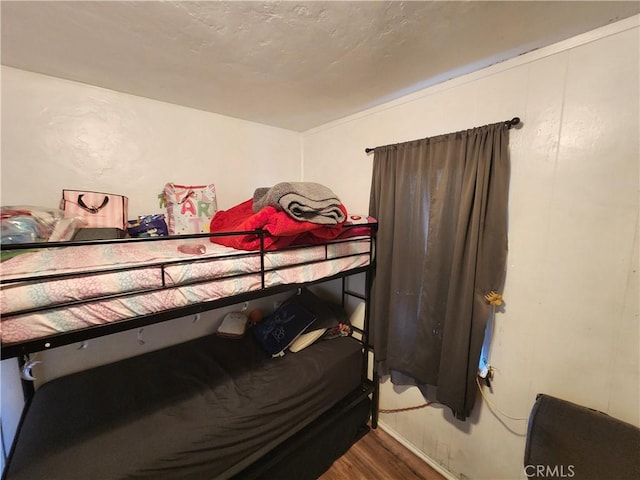 bedroom featuring wood finished floors