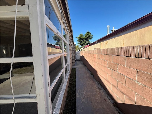 view of home's exterior featuring fence