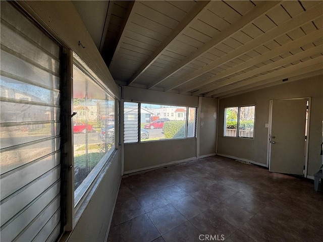 unfurnished sunroom featuring lofted ceiling with beams and wood ceiling