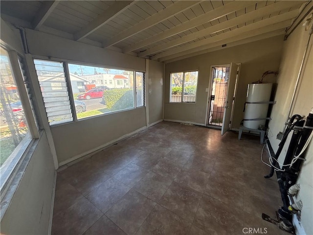 unfurnished sunroom featuring strapped water heater, wooden ceiling, and vaulted ceiling with beams