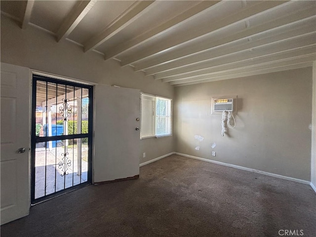 carpeted empty room with beamed ceiling, baseboards, and a wall mounted air conditioner