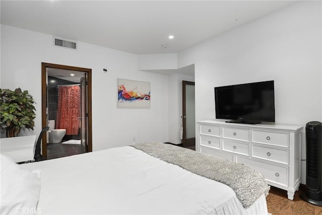 bedroom with visible vents, recessed lighting, and wood finished floors