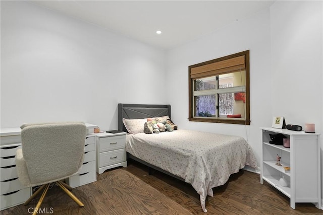 bedroom with recessed lighting and dark wood-style floors