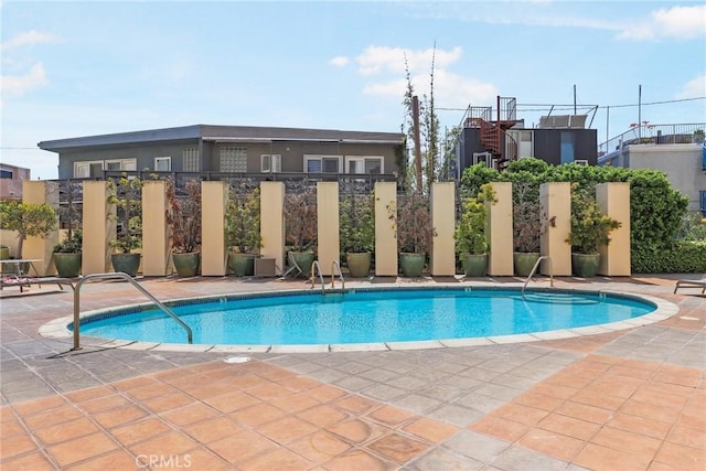 pool featuring a patio area