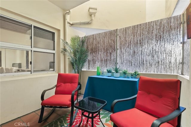 sitting room featuring tile patterned floors