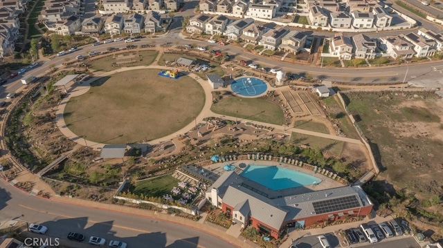 birds eye view of property with a residential view