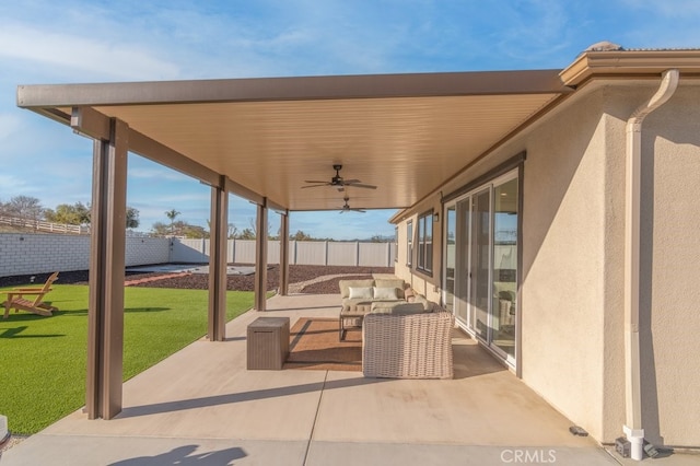 view of patio / terrace featuring outdoor lounge area, fence, and a ceiling fan