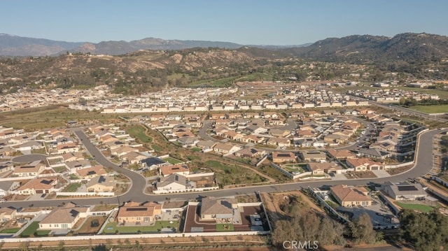 drone / aerial view with a residential view and a mountain view