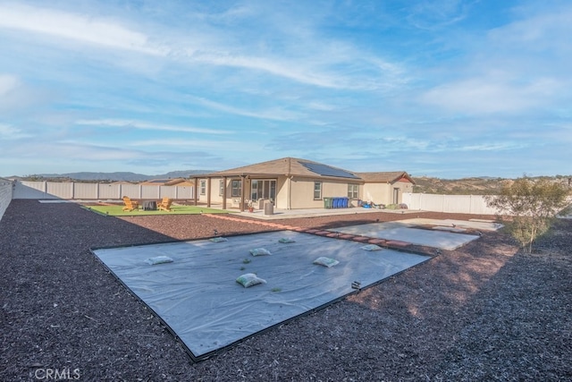 exterior space featuring a patio area and a fenced backyard