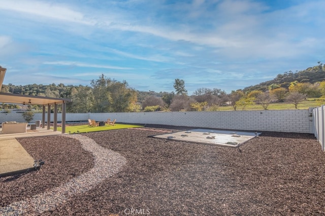 view of yard featuring a patio area and a fenced backyard