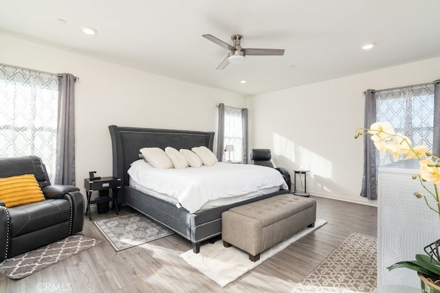 bedroom with recessed lighting, ceiling fan, and wood finished floors