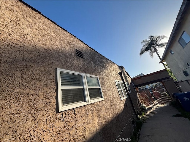 view of side of home featuring stucco siding