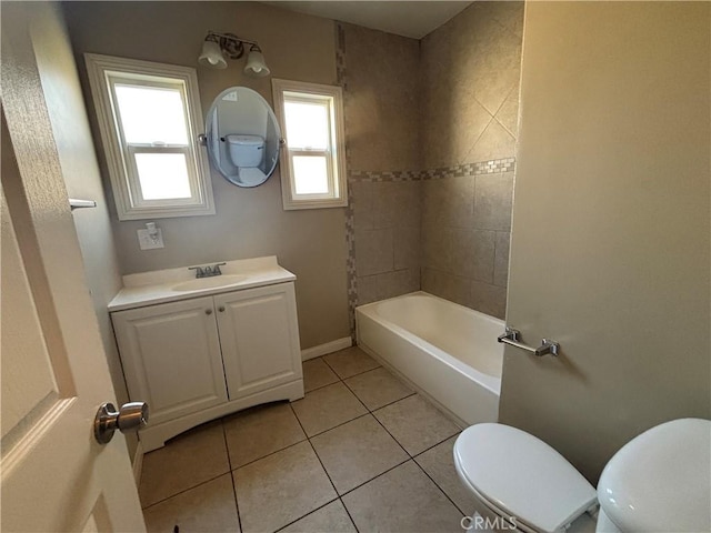 full bath featuring tile patterned flooring, toilet, vanity, and baseboards