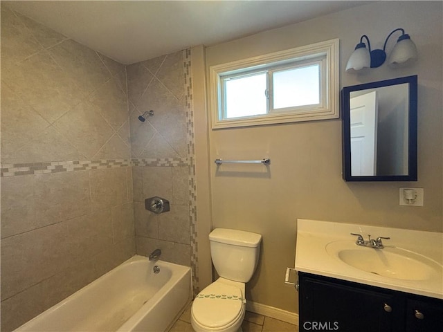 full bath featuring toilet, tile patterned flooring, baseboards, bathing tub / shower combination, and vanity