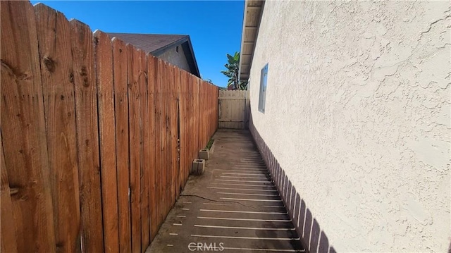 view of home's exterior featuring fence and stucco siding