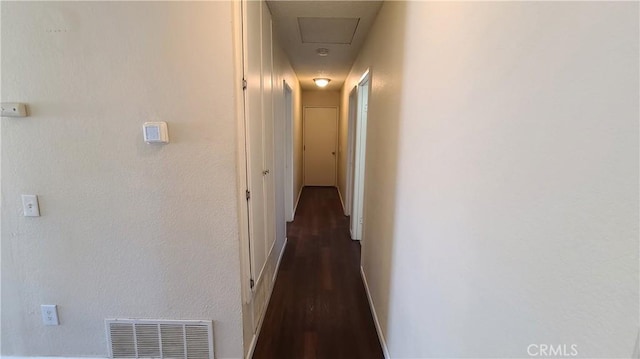 hall with visible vents and baseboards