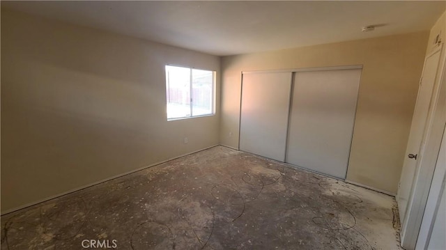 unfurnished bedroom with a closet