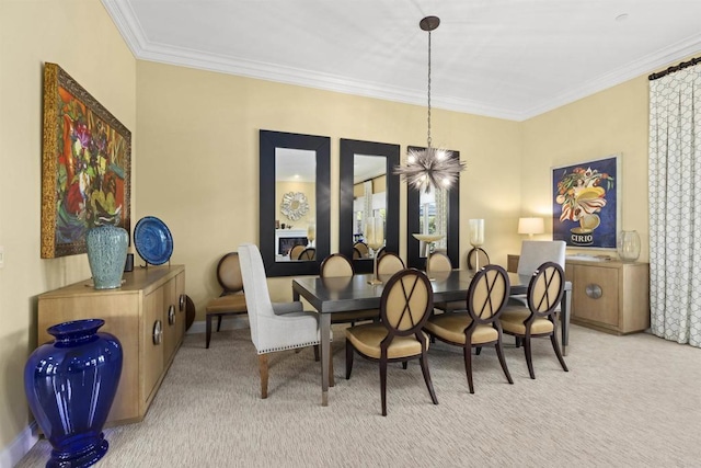 carpeted dining room featuring baseboards and ornamental molding