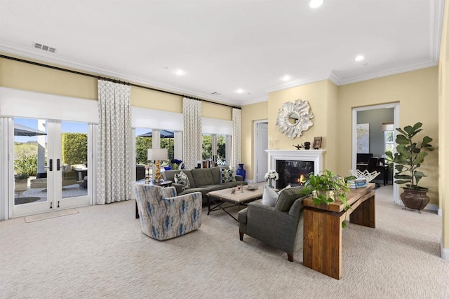 living area with ornamental molding, recessed lighting, carpet floors, and a premium fireplace