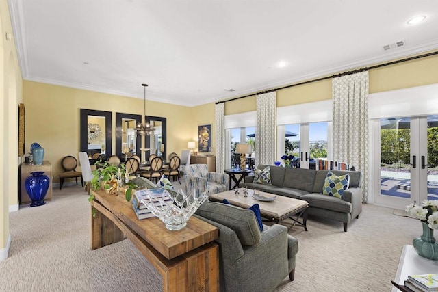 living room with a chandelier, french doors, light carpet, and ornamental molding