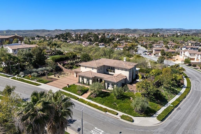 drone / aerial view with a residential view and a mountain view