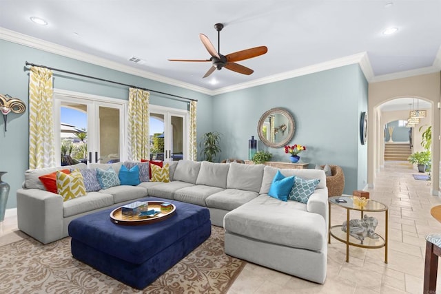 living room featuring visible vents, recessed lighting, french doors, arched walkways, and crown molding