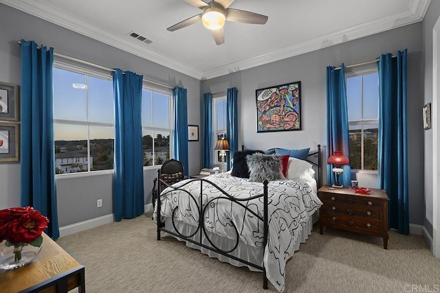 bedroom with visible vents, baseboards, ornamental molding, and carpet flooring