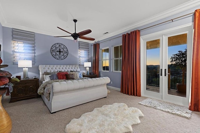 carpeted bedroom with visible vents, ornamental molding, a ceiling fan, and access to outside