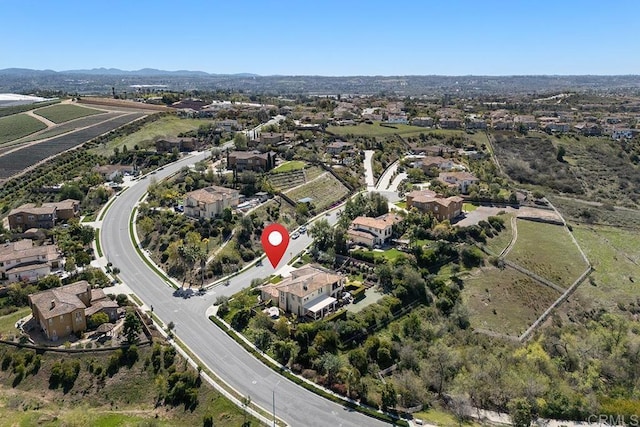 birds eye view of property with a mountain view