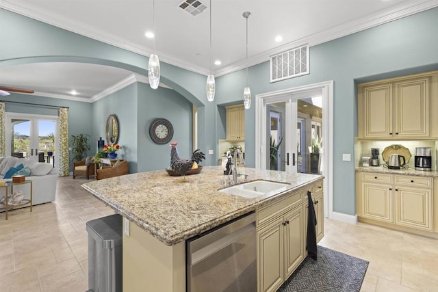 kitchen with a sink, visible vents, cream cabinetry, and dishwasher