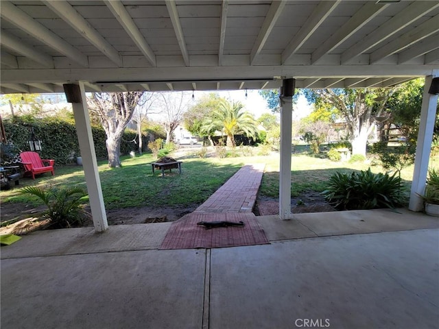 view of patio with an outdoor fire pit