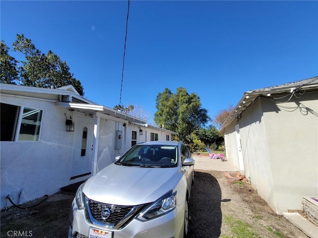 view of property exterior with stucco siding