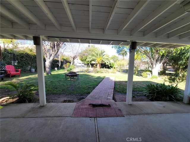 view of patio / terrace with an outdoor fire pit