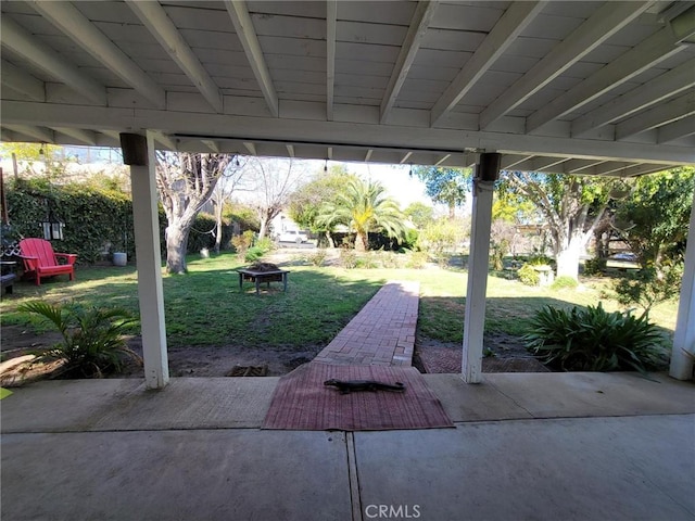 view of patio featuring an outdoor fire pit